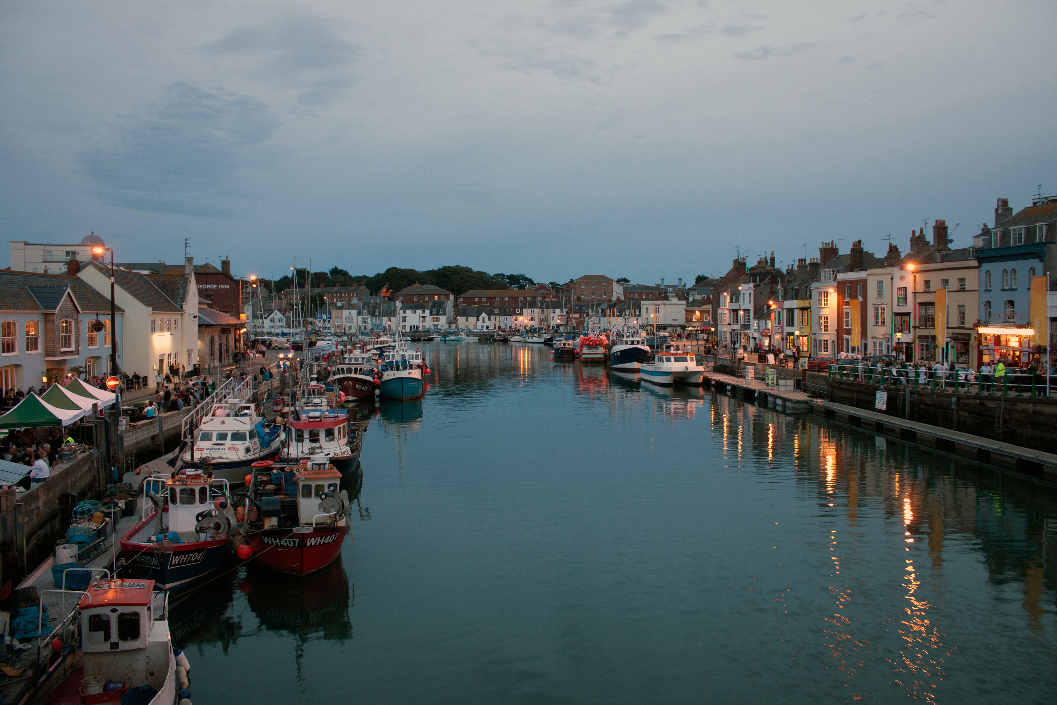 UK – Dorset, Weymouth Harbour during blue hour by Lukes_photos is licensed under CC BY-SA 2.0